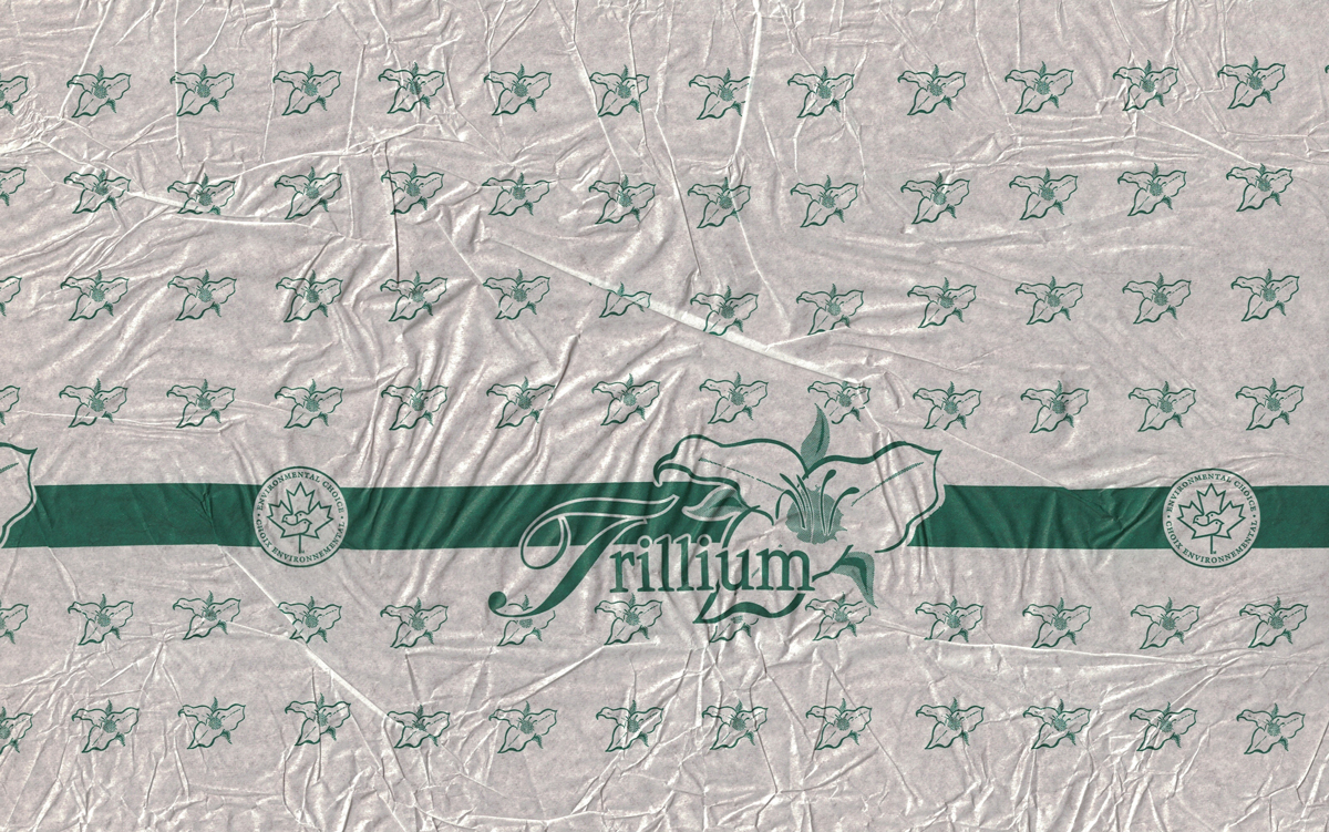 I worked for a company that made various paper products. Some of those were toilet paper and there was a need to design their privately branded logos and wrappers. I designed the logo and wrapper for Trillium brand individually wrapped toilet paper rolls. This is a scan of the printed wrap